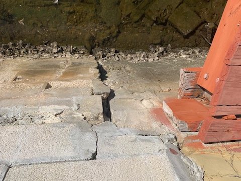 Concrete seawall cap slabs cracked and separated